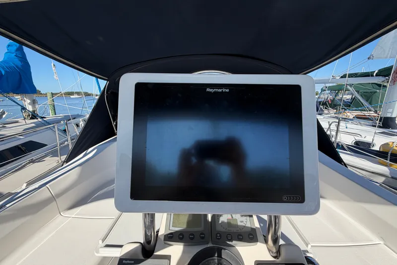 Slide: The Image of Cockpit view of a 2002 Hunter 356 sailboat with Raymarine navigation display. - 23