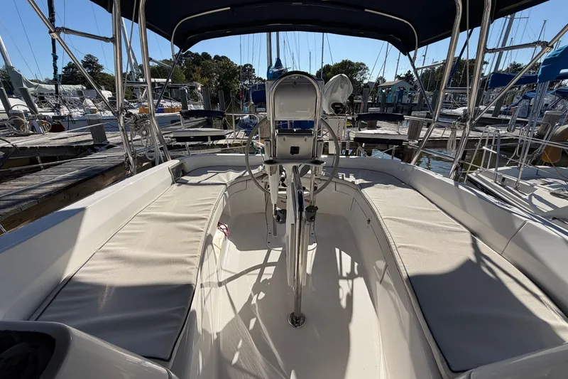 Slide: The Image of Cockpit of a 2002 Hunter 356 sailboat with seating and steering wheel. - 16