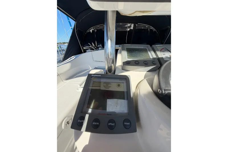 Slide: The Image of Cockpit of 2002 Hunter 356 sailboat with navigation instruments and controls. - 21