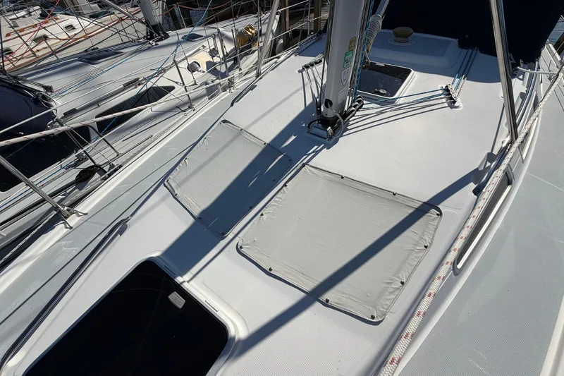 Slide: The Image of Deck of a 2002 Hunter 356 sailboat with rigging and hatches visible. - 8