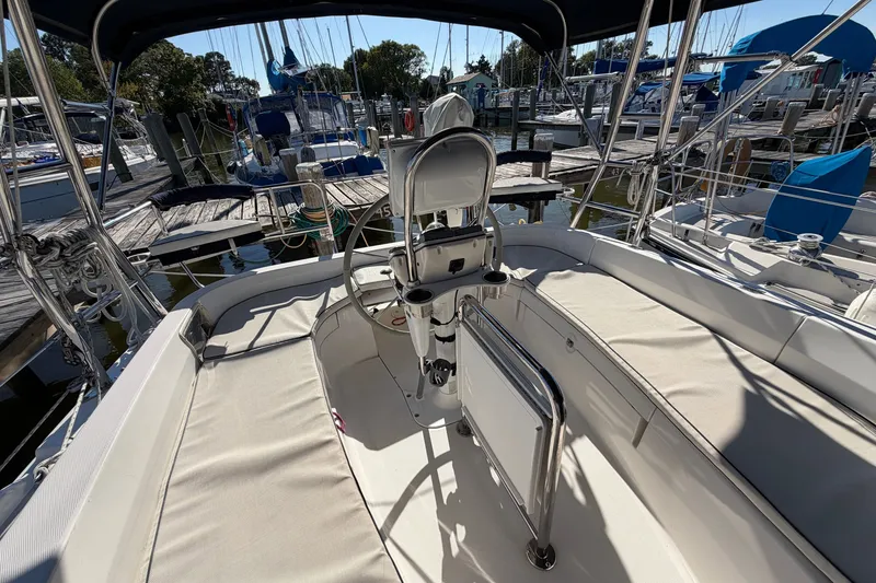Slide: The Image of Cockpit of a 2002 Hunter 356 sailboat docked at a marina. - 19