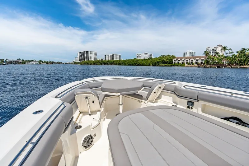 Slide: The Image of 2023 Boston Whaler 380 Outrage boat interior with waterfront cityscape view. - 27