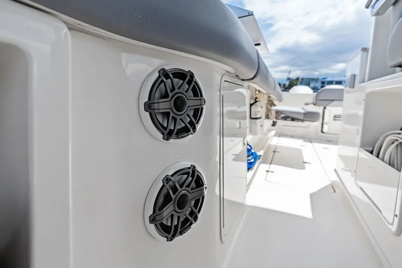 Slide: The Image of 2023 Boston Whaler 380 Outrage boat interior with dual speakers and seating. - 46