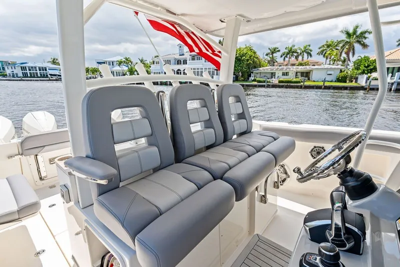 Slide: The Image of 2023 Boston Whaler 380 Outrage interior with sleek seating and modern controls. - 36