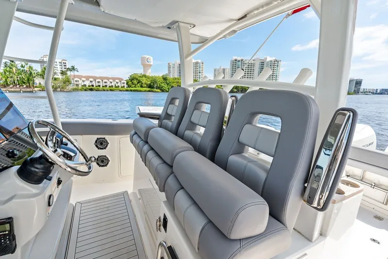 Slide: The Image of 2023 Boston Whaler 380 Outrage boat interior with luxurious seating and modern controls. - 38