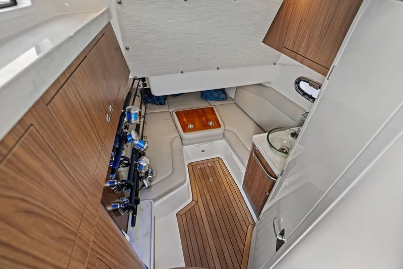 Slide: The Image of Luxurious interior of 2023 Boston Whaler 380 Outrage, featuring wood accents and seating. - 55