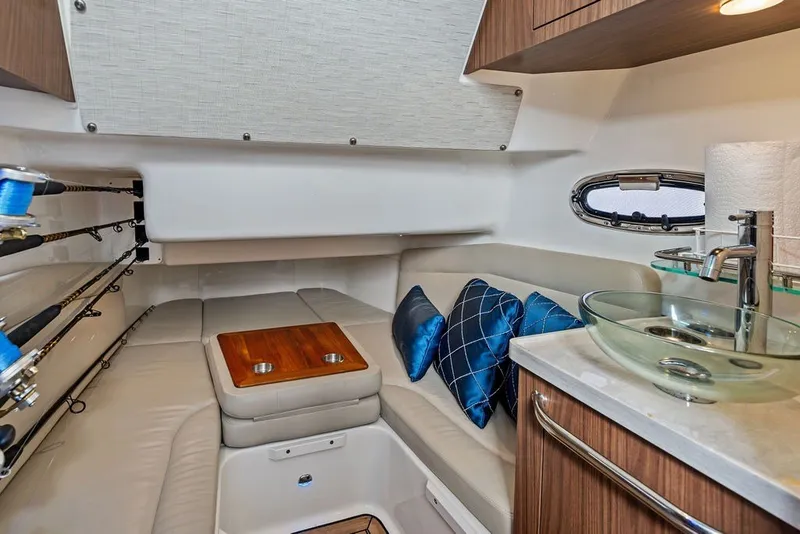Slide: The Image of Luxurious interior of 2023 Boston Whaler 380 Outrage with seating, pillows, and modern sink. - 56