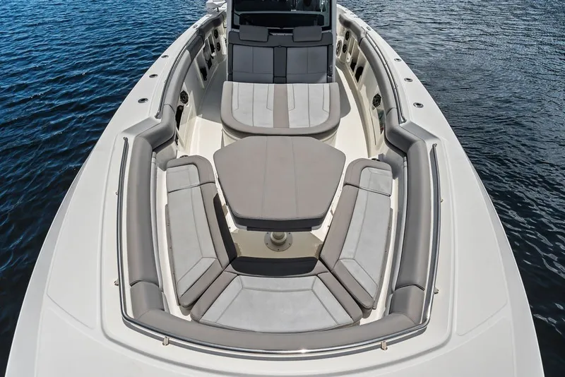 Slide: The Image of 2023 Boston Whaler 380 Outrage boat with spacious seating on calm water. - 30