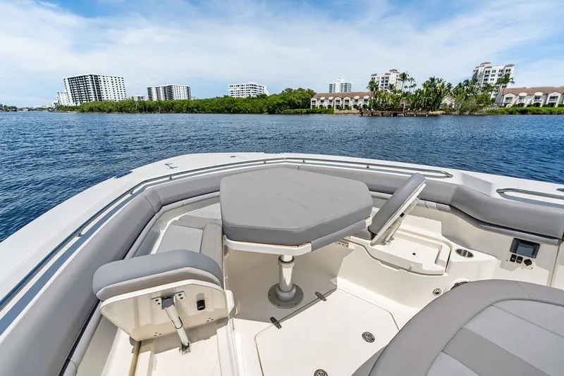 Slide: The Image of 2023 Boston Whaler 380 Outrage boat interior with waterfront view. - 28