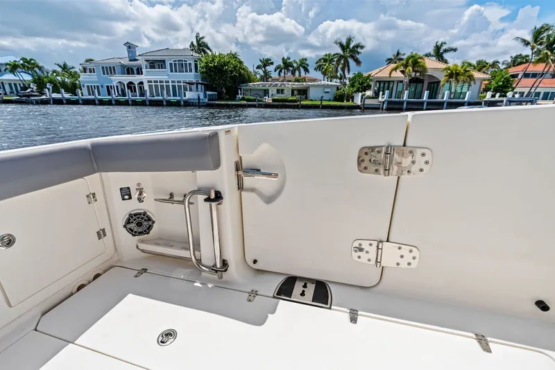 Slide: The Image of 2023 Boston Whaler 380 Outrage boat interior with waterfront view. - 48