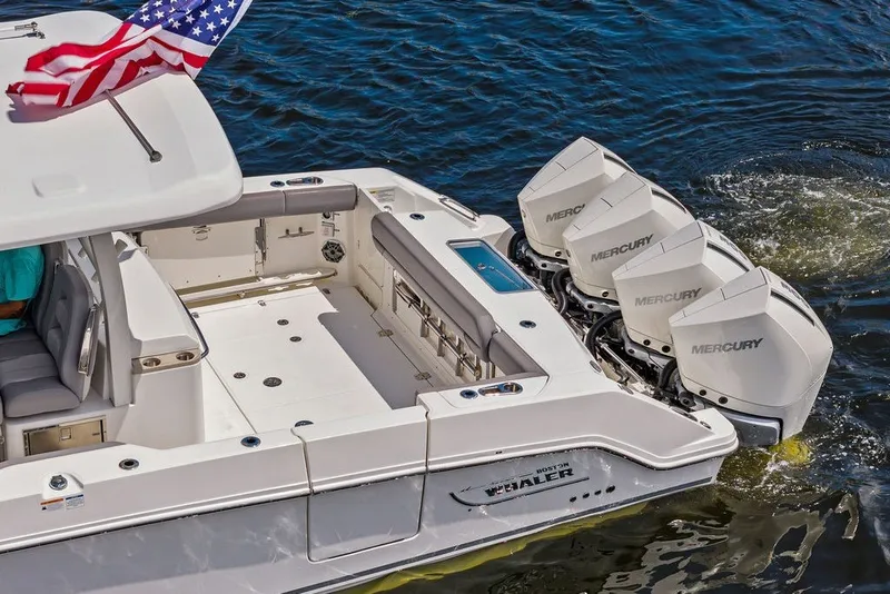 Slide: The Image of 2023 Boston Whaler 380 Outrage with quad Mercury engines on water. - 18