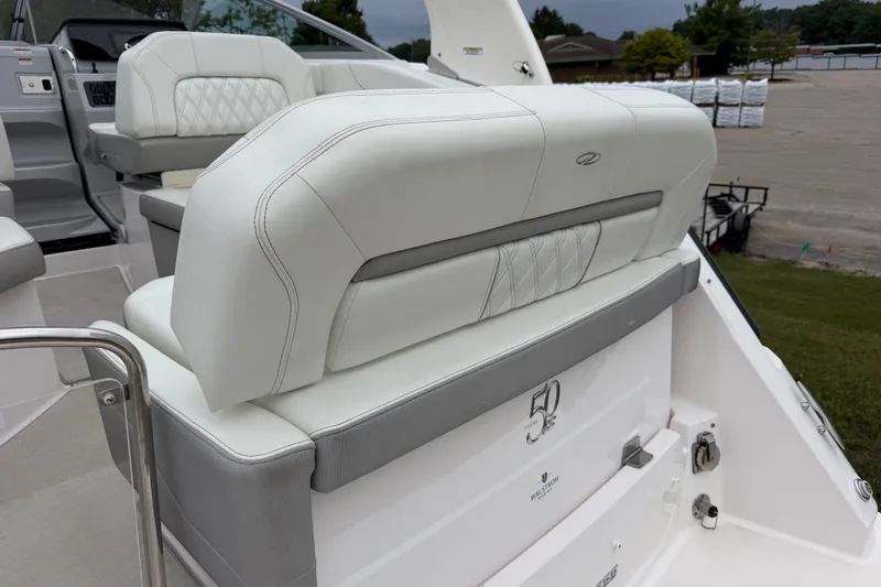 Slide: The Image of 2021 Regal 26 Express boat interior with white leather seating and elegant design. - 13