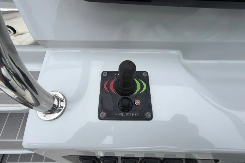 Slide: The Image of Control panel with joystick on 2021 Regal 26 Express boat. - 22