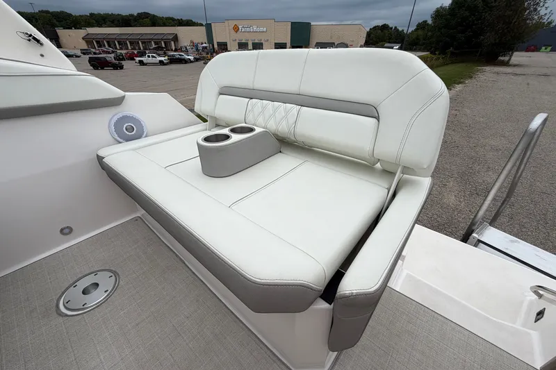 Slide: The Image of Luxurious seating on 2021 Regal 26 Express boat with cup holders and elegant design. - 15