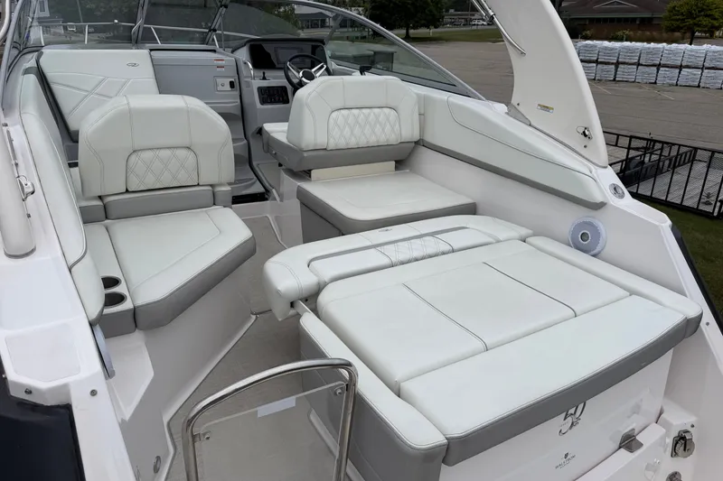 Slide: The Image of 2021 Regal 26 Express boat interior with white leather seating and modern dashboard. - 14