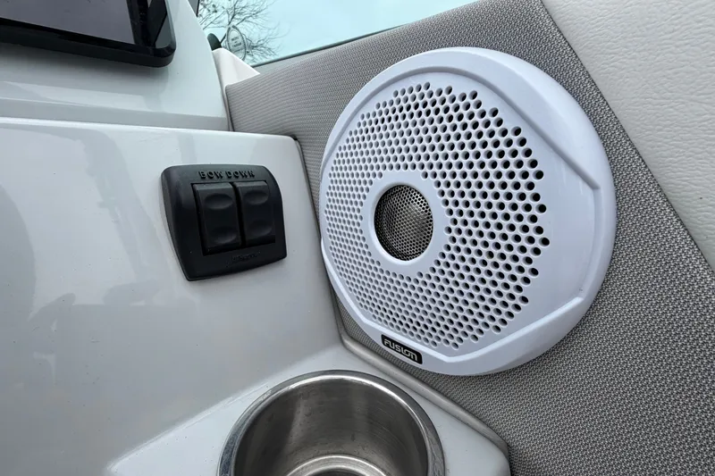 Slide: The Image of 2021 Regal 26 Express boat interior with Fusion speaker and control panel. - 24