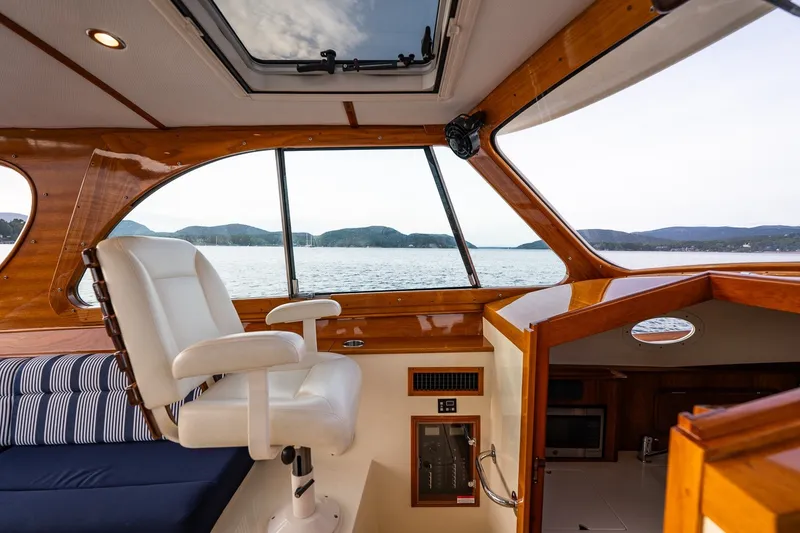 Slide: The Image of Interior of 2018 Hinckley Picnic Boat 34 MKII with scenic water view. - 18