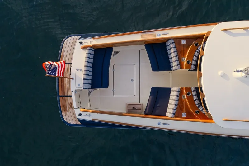 Slide: The Image of Overhead view of 2018 Hinckley Picnic Boat 34 MKII with American flag. - 10