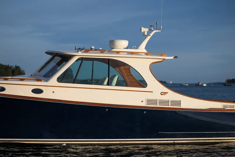 Slide: The Image of 2018 Hinckley Picnic Boat 34 MKII on calm water, side view. - 33