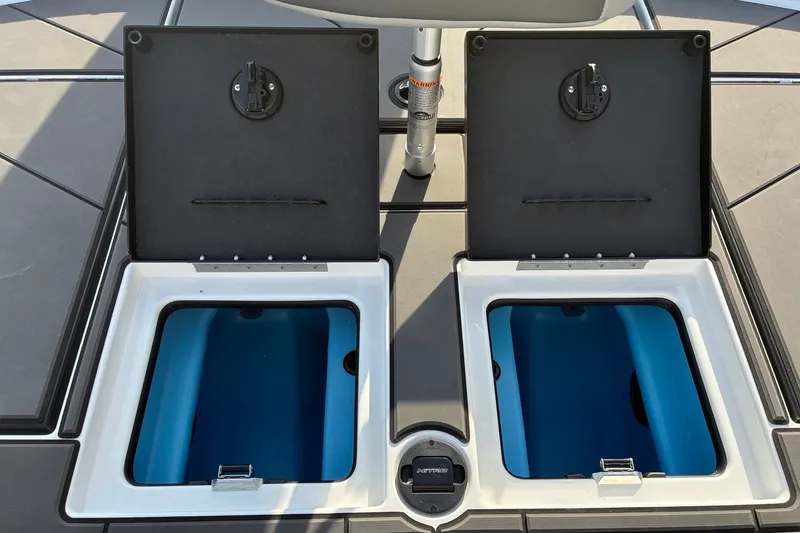 Slide: The Image of 2026 Nitro Z21 XL Pro boat storage compartments open on deck. - 18
