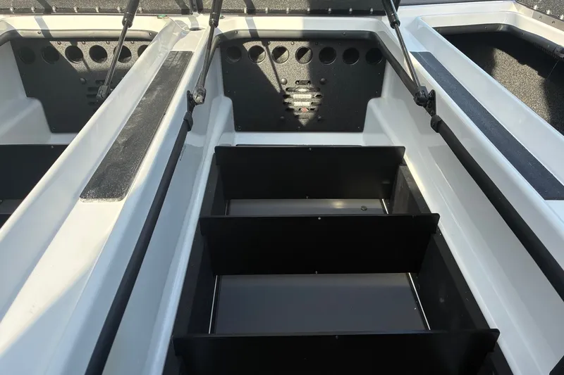 Slide: The Image of 2026 Nitro Z21 XL Pro boat storage compartments with hydraulic lifts and organized interior layout. - 17