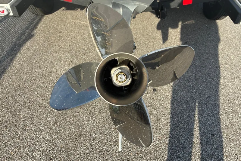 Slide: The Image of Propeller of 2026 Nitro Z21 XL Pro boat on asphalt surface. - 2