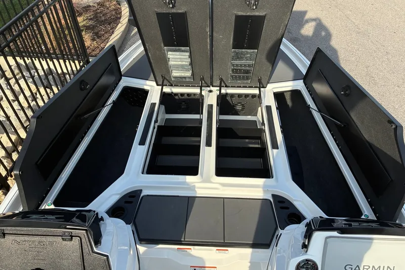 Slide: The Image of 2026 Nitro Z21 XL Pro boat storage compartments open, showcasing spacious interior design. - 15