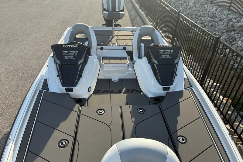 Slide: The Image of 2026 Nitro Z21 XL Pro boat interior with dual seats and storage compartments. - 11
