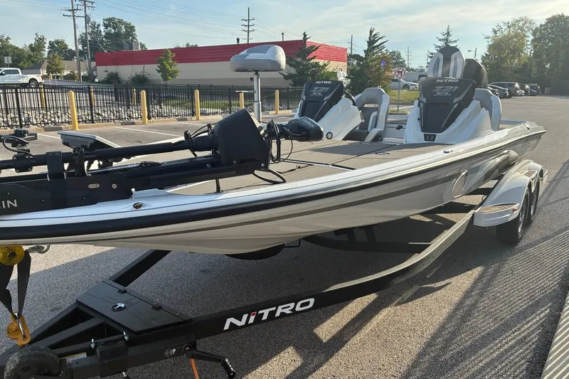 Slide: The Image of 2026 Nitro Z21 XL Pro fishing boat on trailer in parking lot. - 7