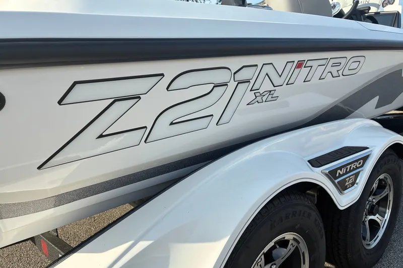 Slide: The Image of 2026 Nitro Z21 XL Pro boat with sleek design and branding on trailer. - 4