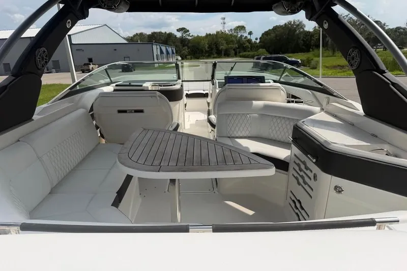 Slide: The Image of 2019 Sea Ray SLX 310 Outboard interior with luxurious seating and sleek design. - 13