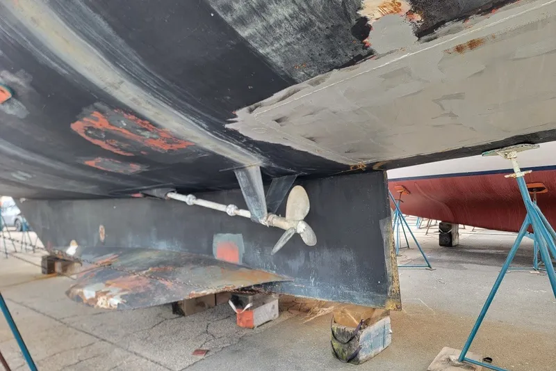 Slide: The Image of Underwater view of 1989 Custom Rob Ladd PH Motorsailer Cutter, showing propeller and hull details. - 77