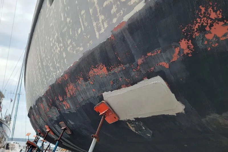 Slide: The Image of Close-up of a 1989 Rob Ladd PH Motorsailer Cutter hull under restoration. - 67