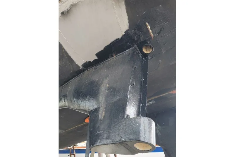 Slide: The Image of Close-up of the hull of a 1989 Custom Rob Ladd PH Motorsailer Cutter. - 62