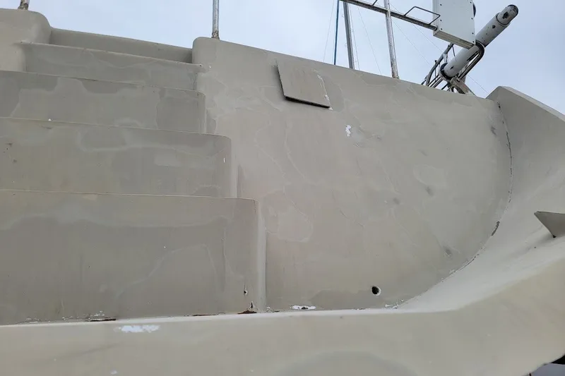 Slide: The Image of Staircase on a 1989 Custom Rob Ladd PH Motorsailer Cutter, showing deck details. - 52