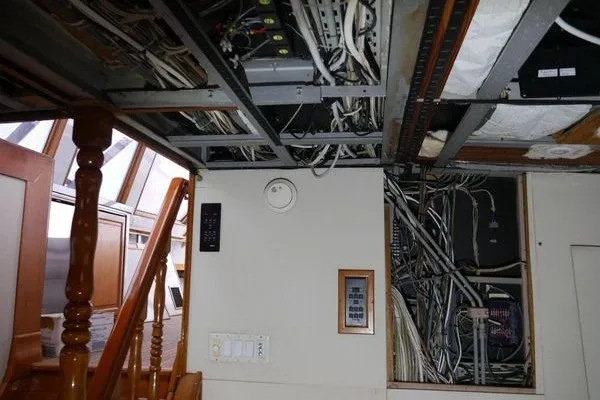 Slide: The Image of Interior wiring and control panels of a 1989 Custom Robb Ladd Pilothouse Cutter, 98 PH Motorsailer. - 12
