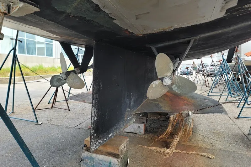 Slide: The Image of Underwater view of 1989 Rob Ladd PH Motorsailer Cutter's dual propellers on stands. - 76