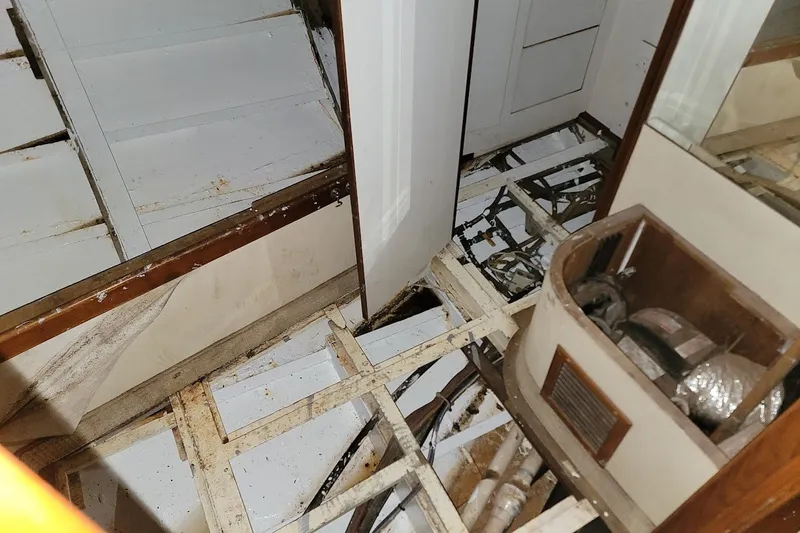 Slide: The Image of Interior view of 1989 Rob Ladd PH Motorsailer Cutter project, showing exposed framework and equipment. - 39