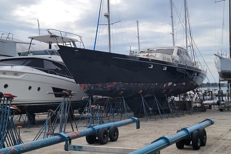 Slide: The Image of Custom 1989 Rob Ladd PH Motorsailer Cutter on stands in a boatyard. - 71