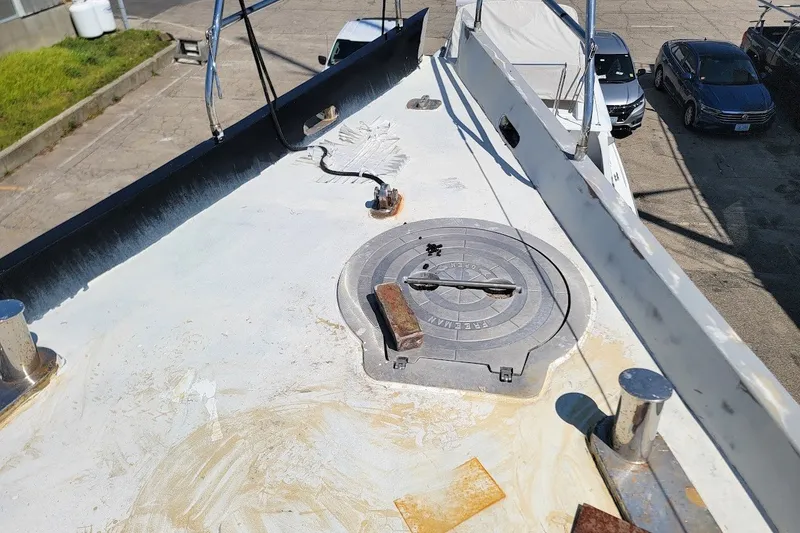 Slide: The Image of Deck of 1989 Custom Robb Ladd Pilothouse Cutter, showing hatch and fittings. - 15