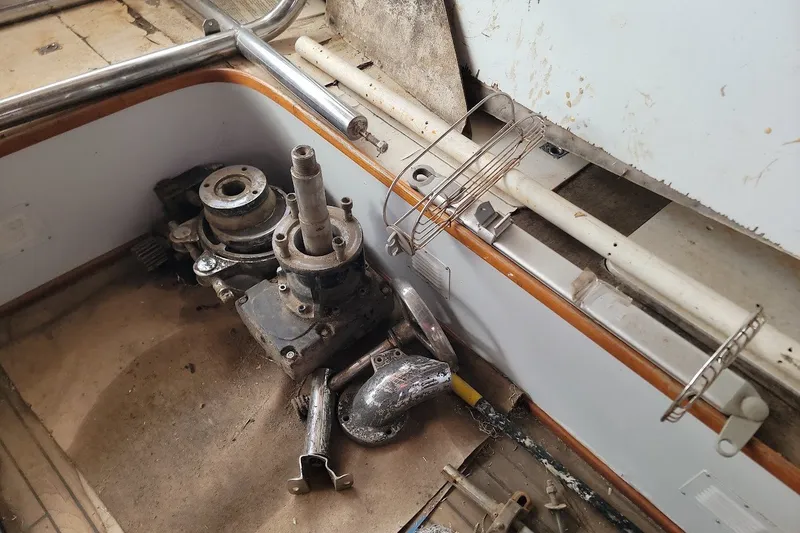 Slide: The Image of Old boat parts and equipment in a 1989 Rob Ladd PH Motorsailer Cutter project. - 34