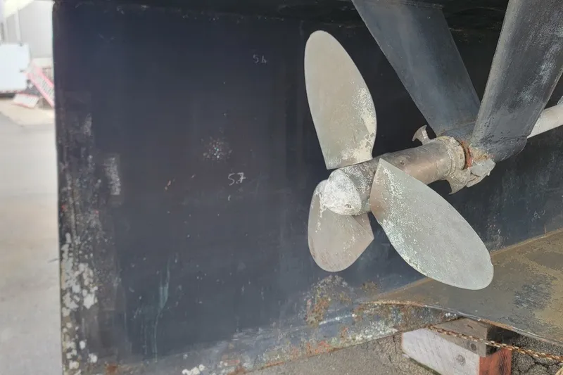 Slide: The Image of Propeller of 1989 Custom Rob Ladd PH Motorsailer Cutter, showing wear and rust. - 66