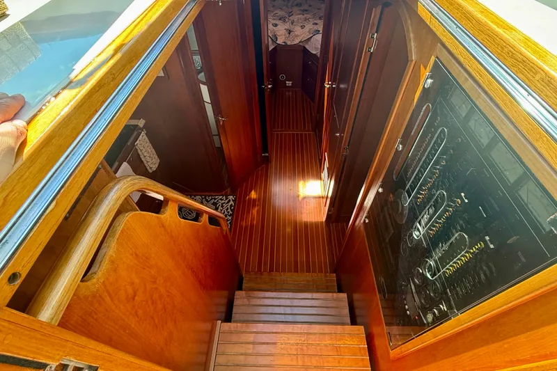 Slide: The Image of Interior view of 1999 Alden 40 Express yacht, featuring wooden stairs and paneling. - 38