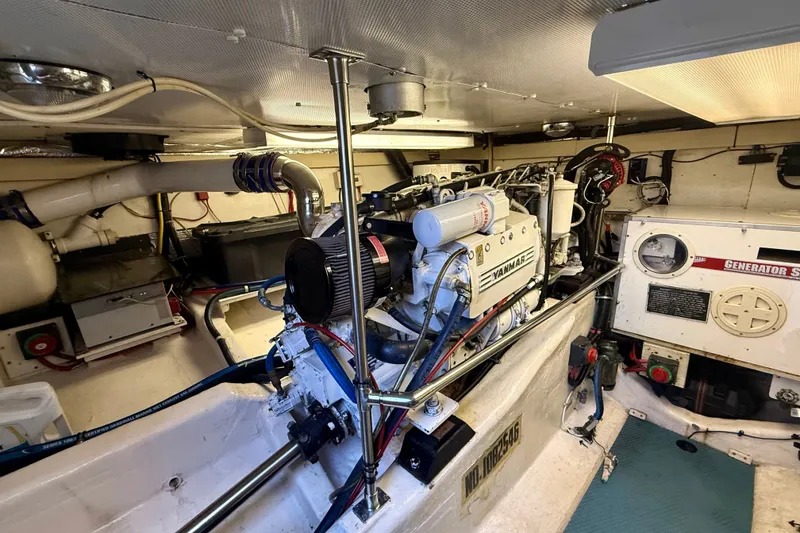 Slide: The Image of Engine room of a 1999 Alden 40 Express yacht with Yanmar engine and generator. - 54