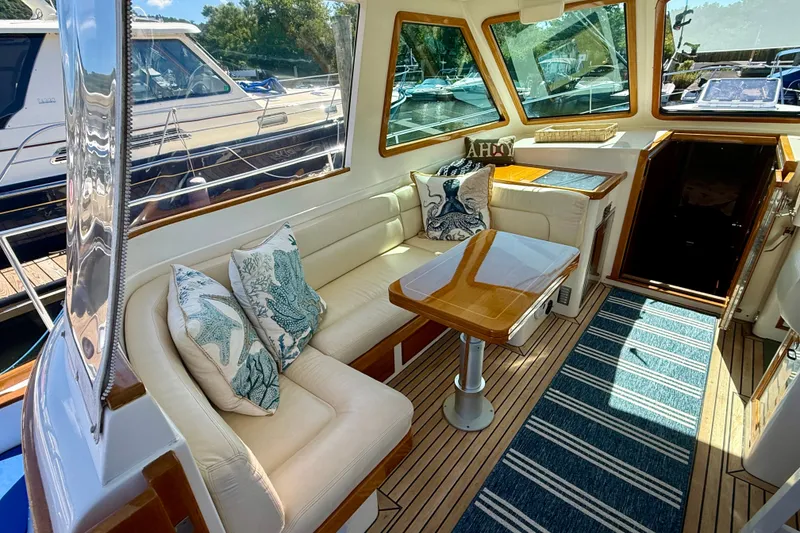 Slide: The Image of Luxurious interior of a 1999 Alden 40 Express yacht with elegant seating and nautical decor. - 30