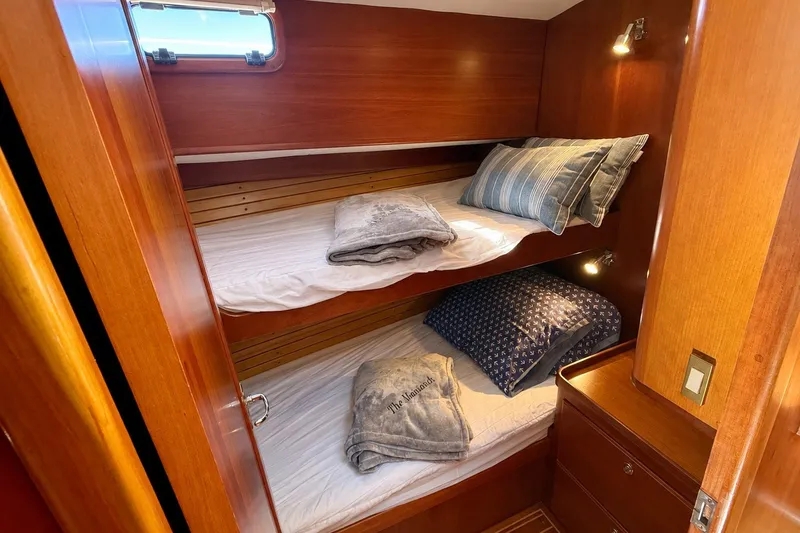 Slide: The Image of Cozy cabin with wooden bunk beds in a 1999 Alden 40 Express yacht. - 40