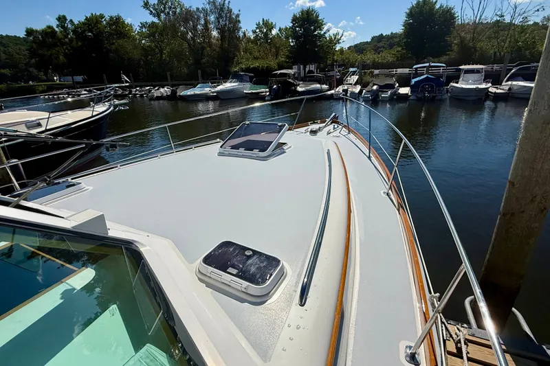 Slide: The Image of Alden 40 Express 1999 yacht docked at marina, surrounded by other boats. - 18
