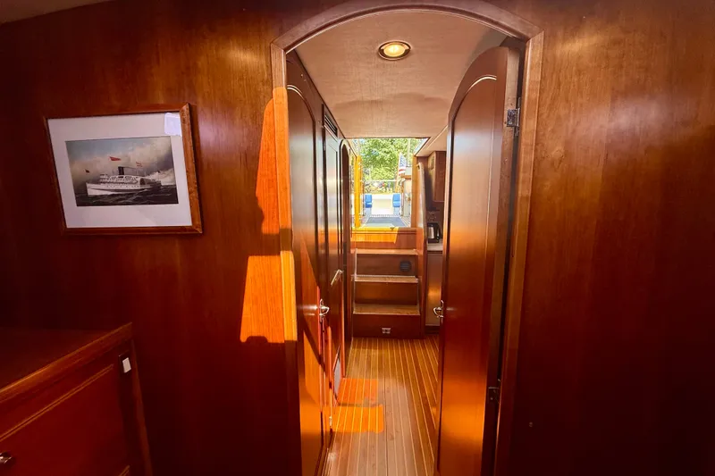Slide: The Image of Interior of 1999 Alden 40 Express yacht with wooden paneling and nautical decor. - 49