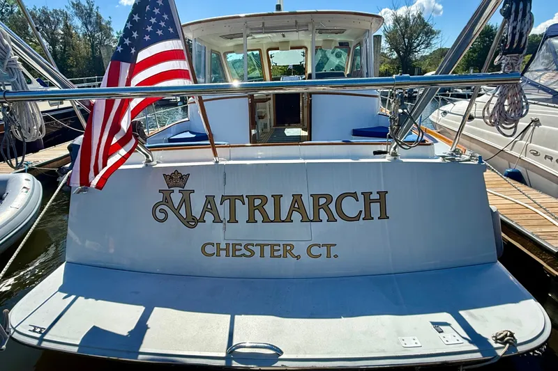 Slide: The Image of Alden 40 Express 1999 yacht "Matriarch" docked in Chester, CT with American flag. - 8