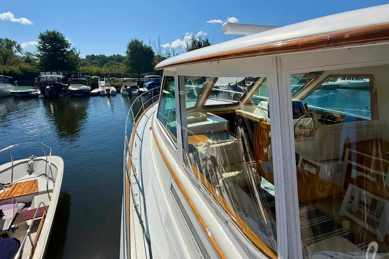 Slide: The Image of Alden 40 Express 1999 yacht docked at a marina on a sunny day. - 16